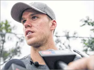  ?? THE CANADIAN PRESS/CHRISTOPHE­R KATSAROV ?? Connor Mcdavid speaks to press after competing against Aaron Sanchez and Eugenie Bouchard in a “60 Second Scramble” promotiona­l event ahead of the Rogers Cup on Wednesday.