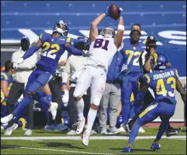  ?? Associated Press ?? BIG CATCH — Buffalo Bills tight end Tyler Kroft (81) catches a pass in front of the Rams’ Troy Hill (22) and John Johnson (43) during the second half on Sunday in Orchard Park, N.Y. Kroft caught the winning touchdown with 15 seconds remaining in the Bills’ 35-32 win over the Rams.