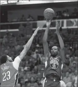  ?? The Associated Press ?? TO THE BRINK: Golden State forward Kevin Durant (35) shoots over Pelicans forward Anthony Davis (23) Sunday in the first half of the Warriors’ 118-92 win in New Orleans to take a 3-1 lead in the second round of the NBA playoffs.