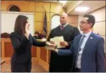  ?? EVAN BRANDT — DIGITAL FIRST MEDIA ?? Newly elected Pottstown Mayor Stephanie Henrick took the oath of office Tuesday night, administer­ed by District Judge Scott Palladino. Interim Borough Manager Justin Keller is holding the Bible.