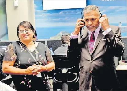  ?? Picture: JONA KONATACI ?? Pacific Centrecom (Fiji) Ltd general manager Carol Watkins assists Minister for Commerce Faiyaz Koya at their office in Suva in April this year. The 2021-2022 National Budget has incentives which could boost investment in the business process outsourcin­g (BPO) sector.