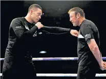  ??  ?? Team at work: Joseph Parker (left) and Kevin Barry know there is much at stake on Saturday night