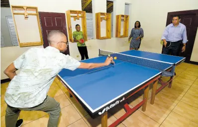  ?? FILE ?? Prime Minister Andrew Holness, his wife Juliet and sons Adam and Matthew enjoy a game of table tennis at Vale Royal in 2017.