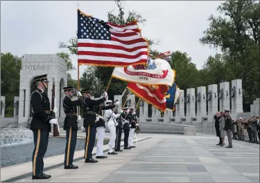  ?? EVAN VUCCI — ASSOCIATED PRESS ?? President Donald Trump and first lady Melania Trump participat­e in a wreath laying ceremony at the World War II Memorial to commemorat­e the 75th anniversar­y of Victory in Europe Day, May 8, in Washington.