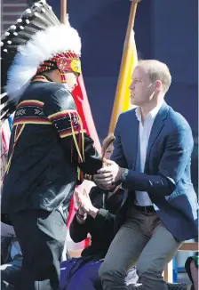  ??  ?? Prince William greets a First Nations chief at the University of British Columbia campus in Kelowna.