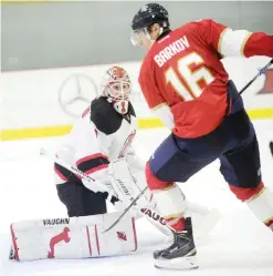 ?? — AP ?? WEST POINT: New Jersey Devils goalie Keith Kinkaid (1) defends Florida Panthers center Aleksander Barkov (16) during the third period of an NHL preseason hockey game, Saturday, in West Point, NY. The Panthers won 4-2.