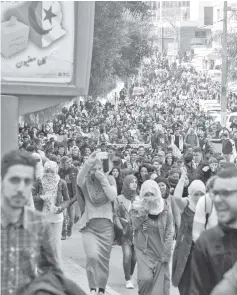  ??  ?? Algerian students take part in a protest in the capital Algiers against Bouteflika’s bid for a fifth term. — AFP photo