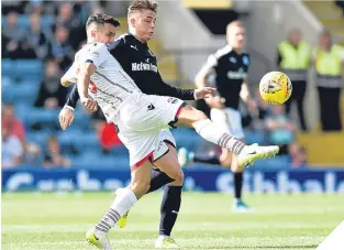  ??  ?? Ross County’s Tim Chow (left) battles for the ball with Scott Allan.