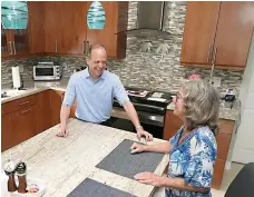  ?? AP Photo/Marta Lavandier ?? Mark Bendell and his wife, Laurie, talk Monday in their kitchen in Boca Raton, Fla. A stock market slump this year, which has taken big bites out of investors’ portfolios, including retirement plans like 401(k)s, is worrying Americans who are within a few years of retirement.