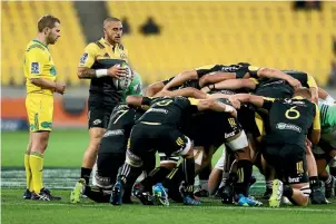  ?? PHOTO: GETTY IMAGES ?? The job of Hurricanes halfback TJ Perenara is to get the ball in and out of the scrum as quickly as possible.