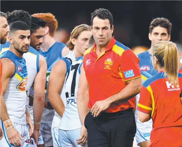  ?? Picture: AAP IMAGES ?? Interim Suns coach Dean Solomon (centre) is at the helm, but should the AFL club go for someone with more experience?