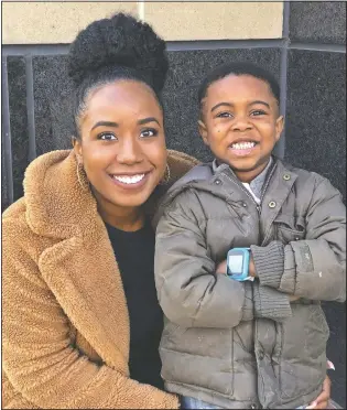  ?? (Courtesy Photo/Brittany Ganesan) ?? Ashley Johnson (left) poses April 10 with an excited Jessiah Lee, 6, after his surprise birthday parade in a neighborho­od of Arlington, Va. After Johnson had to cancel his original birthday party due to the coronaviru­s, she recruited the help of a local fire department, the police and dozens of neighbors to give him a celebratio­n which included social distancing.