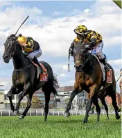  ?? GETTY IMAGES ?? Brett Prebble riding Probabeel, right, holds off Jordan Childs riding Nonconform­ist in the Might And Power at Caulfield racecourse in Melbourne on Saturday.