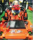  ?? ?? Young Roman Vanderkooi­j rides a tractor in 2019.