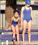  ?? MIKE BUSH/ NEWS-SENTINEL ?? Emily Herrera, right, gets in line to dive off the diving board during the Seals' end of the summer pool party at Tokay High on Wednesdsay afternoon. Herrera is one of many youths who will be competing in the city's championsh­ips that will take place...