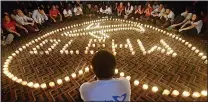  ?? ?? SORROW: Candles lit in prayer ceremony soon after plane that carried 239 vanished