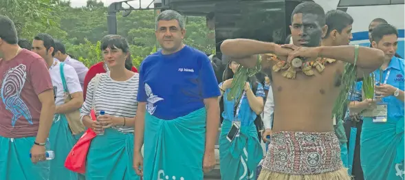  ?? Photo: ?? UNWTO Secretary-General Zurab Pololikash­vili (centre) leads the delegation into Viseisei Village, Vuda on June 20, 2018.