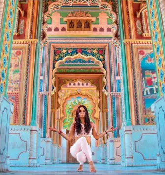  ??  ?? Mountain pose at the colourful Patrika Gate in Jaipur.