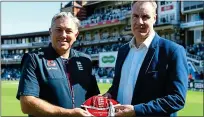  ??  ?? The cap fits: Chris Silverwood with England head of coach developmen­t John Neal, a member of the ECB panel which gave the bowling coach the top job