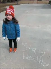  ?? PHOTO COURTESY OF SEBASTIAN PREVITI ?? Washington Township has the Walk and Wave nightly at 7 p.m. to encourage outdoor activity while maintainin­g six foot social distancing. A Chalk Walk was held on March 22 to encourage writing positive sidewalk messages in the community. Pictured is Lucia Previti, daughter of Washington Township Trustee Sebastian Previti, during the Chalk Walk.