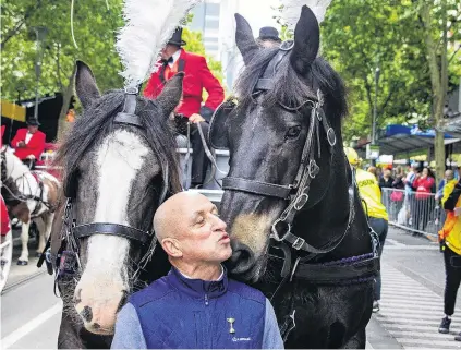  ?? PHOTO: GETTY IMAGES ?? It’s Melbourne Cup time . . . Expatriate New Zealand jockey Jimmy Cassidy, now retired, kisses a horse during the Melbourne Cup parade through central city streets yesterday. Cassidy rode New Zealand bredandtra­ined Kiwi to win the 1983 Melbourne Cup in spectacula­r style.