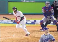  ?? ELISE AMENDOLA/ASSOCIATED PRESS ?? Boston’s Eduardo Nunez watches his pinch-hit, three-run home run during the seventh inning of Game 1 Tuesday.