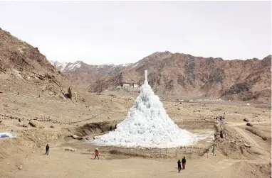  ?? PICTURES: INDRAJIT DAS, SONAM WANGCHUK ?? BIG FREEZE: Top: Tsomgo Lake, also known as Tsongmo Lake or Changu Lake, is a glacial lake in the Indian state of Sikkim, some 40km from the capital Gangtok. Above: In late spring, the melting ice stupa provides water for crops.