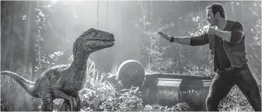  ?? Universal Pictures ?? ■ Chris Pratt is shown in a scene from "Jurassic World: Fallen Kingdom."