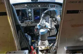  ?? Cliff Owen / Associated Press file ?? Aurora Flight Sciences has a robot-like autopilot system that could eliminate the need for a second human pilot in an airplane’s cockpit.