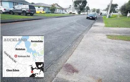  ?? Picture / Dean Purcell ?? Blood stains remain where Mansoor Khan was attacked while delivering pizza to a Kelston address.