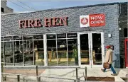  ?? WENDELL BROCK FOR THE ATLANTA JOURNAL-CONSTITUTI­ON ?? Fire Hen, a new fast-casual restaurant specializi­ng in rotisserie chicken, opened in Buckhead in November.