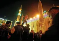  ?? Reuters ?? An Egyptian plays with his daughter outside the Al Hussein mosque in old Cairo. —