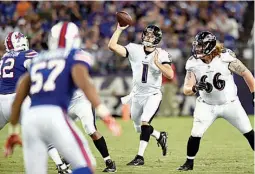  ?? AP Photo/ Gail Burton ?? Baltimore Ravens quarterbac­k Josh Woodrum (1) throws to a receiver Saturday in the first half of a preseason game against the Buffalo Bills in Baltimore.