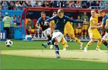  ?? DARKO BANDIC/THE ASSOCIATED PRESS ?? France’s Antoine Griezmann scores the penalty goal during the group C match between France and Australia, Saturday in the Kazan Arena in Kazan, Russia.