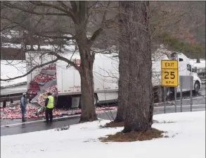  ?? Contribute­d / John Mastracchi­o ?? A truck hit a bridge on the Hutchinson River Parkway, spilling its load of energy drink onto the roadway on Tuesday morning.
