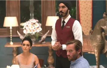  ?? — Photo by Mark Rogers, Bleecker Street ?? From left: Nazanin Boniadi, Dev Patel and Armie Hammer play characters trapped inside a luxury hotel that has been taken over by militant Islamic terrorists.