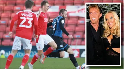  ?? DY Sporting ?? ●● Life coaches Nik and Eva Speakman (inset) were seen at Rochdale’s game with Swindon S Town on Tuesday, sparking questions from fans