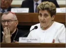  ?? ASSOCIATED PRESS ?? Mariella Enoc, president of Bambino Gesu Pediatric Hospital, flanked by Vatican Secretary of State, Cardinal Pietro Parolin, releases the hospital’s annual report at the Vatican Tuesday.