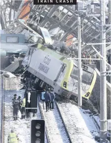  ??  ?? MEMBERS of rescue services work at the scene of a horror train crash in Ankara, Turkey. A high-speed train hit a railway engine and crashed into a pedestrian overpass at a station in the Turkish capital yesterday killing nine people and injuring 47. |