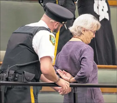  ?? CP PHOTO ?? A protester in the public gallery is handcuffed by Queens Park legislatur­e security during question period at the Ontario legislatur­e in Toronto on Wednesday.