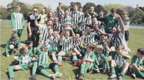  ?? PICTURE BY KATE SHEMILT KS190217 ?? Chichester City and supporters celebrate after being presented with the SCFL premier division trophy