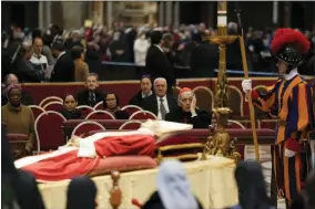  ?? AP PHOTO/BEN CURTIS ?? The body of late Pope Emeritus Benedict XVI is lied out in state inside St. Peter’s Basilica at The Vatican, Wednesday, Jan. 4, 2023. Pope Benedict, the German theologian who will be remembered as the first pope in 600years to resign, has died, the Vatican announced Saturday, Dec. 31, 2022. He was 95.