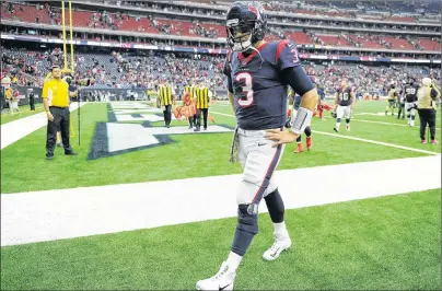  ??  ?? Houston Texans quarterbac­k Tom Savage walks off the field after his team’s loss to the Indianapol­is Colts in an NFL game Sunday in Houston.