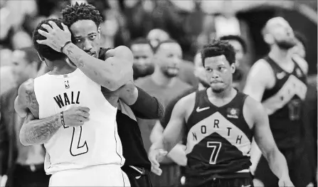  ?? JOHN MCDONNELL THE WASHINGTON POST ?? Wizards’ John Wall is embraced by Raptors’ DeMar DeRozan after the game as Toronto’s Kyle Lowry readies for a postgame handshake on Friday night in Game 6 of their National Basketball Associatio­n opening-round series. The Raptors face the Cavaliers in...