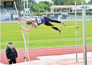  ?? PHOTO: LINDA ROBERTSON ?? Over she goes . . . Taieri athlete Gabi Horo (16) nudges the bar during the pole vault at an Athletics Otago meeting at the Caledonian Ground on Saturday.
