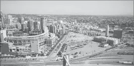  ??  ?? THE CHARGERS football franchise wants a new stadium/convention venue built near the clock tower at right, several blocks from the existing convention center.