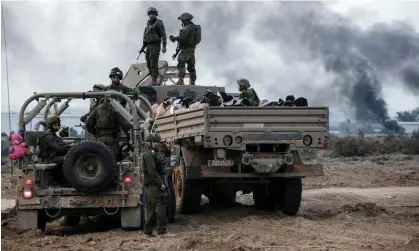  ?? ?? Israeli soldiers stand on a truck with Palestinia­n detainees in Gaza, in December 2023. Photograph: Moti Milrod/Reuters