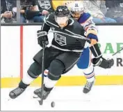  ?? WALLY SKALIJ Los Angeles Times ?? KINGS DEFENSEMAN Vladislav Gavrikov fends off Edmonton’s Evander Kane during a Game 3 loss.