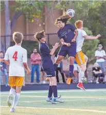  ?? GABRIELA CAMPOS/THE NEW MEXICAN ?? Santa Fe High’s Sebastian Lopez heads the ball during Tuesday’s match against Taos.