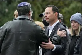  ?? ASSOCIATED PRESS FILE PHOTO ?? Pennsylvan­ia Attorney General Josh Shapiro, center, attends a Commemorat­ion Ceremony in Schenley Park, in Pittsburgh’s Squirrel Hill neighborho­od, on Wednesday, Oct. 27, 2021, three years after a gunman killed 11 worshipper­s at the Tree of Life Synagogue. Shapiro will be taking office as Pennsylvan­ia’s next governor in January 2023after running a campaign in which he spoke early and often about his Jewish religious heritage.